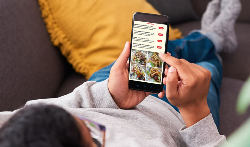 Person scrolling on phone ordering food from Larry's